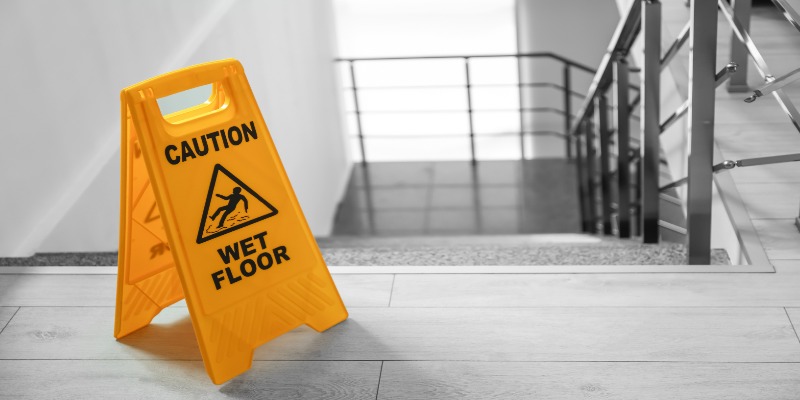 Wet floor sign on staircase